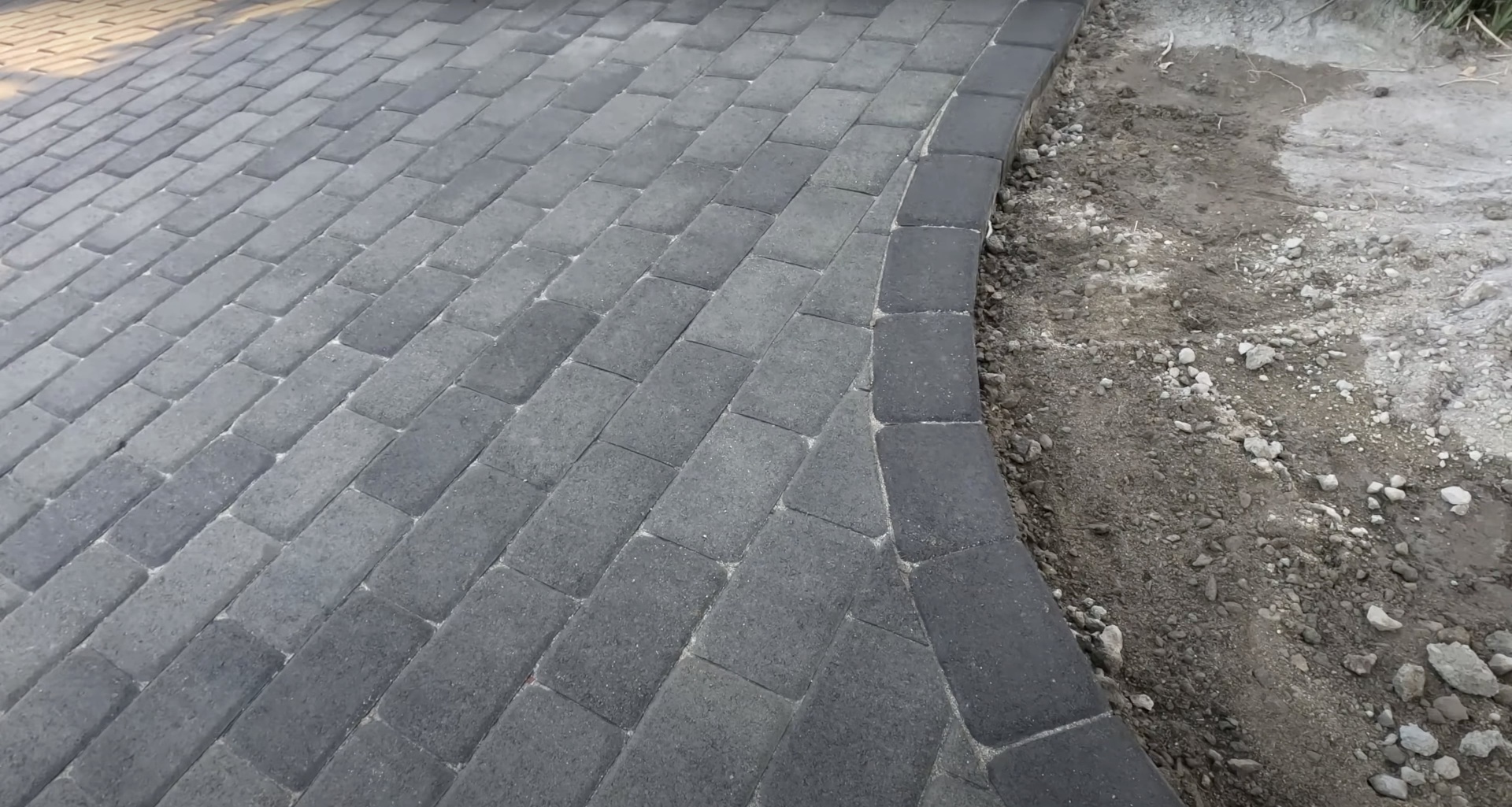 High-quality interlocking concrete paver installation with precise geometric pattern and professional craftsmanship