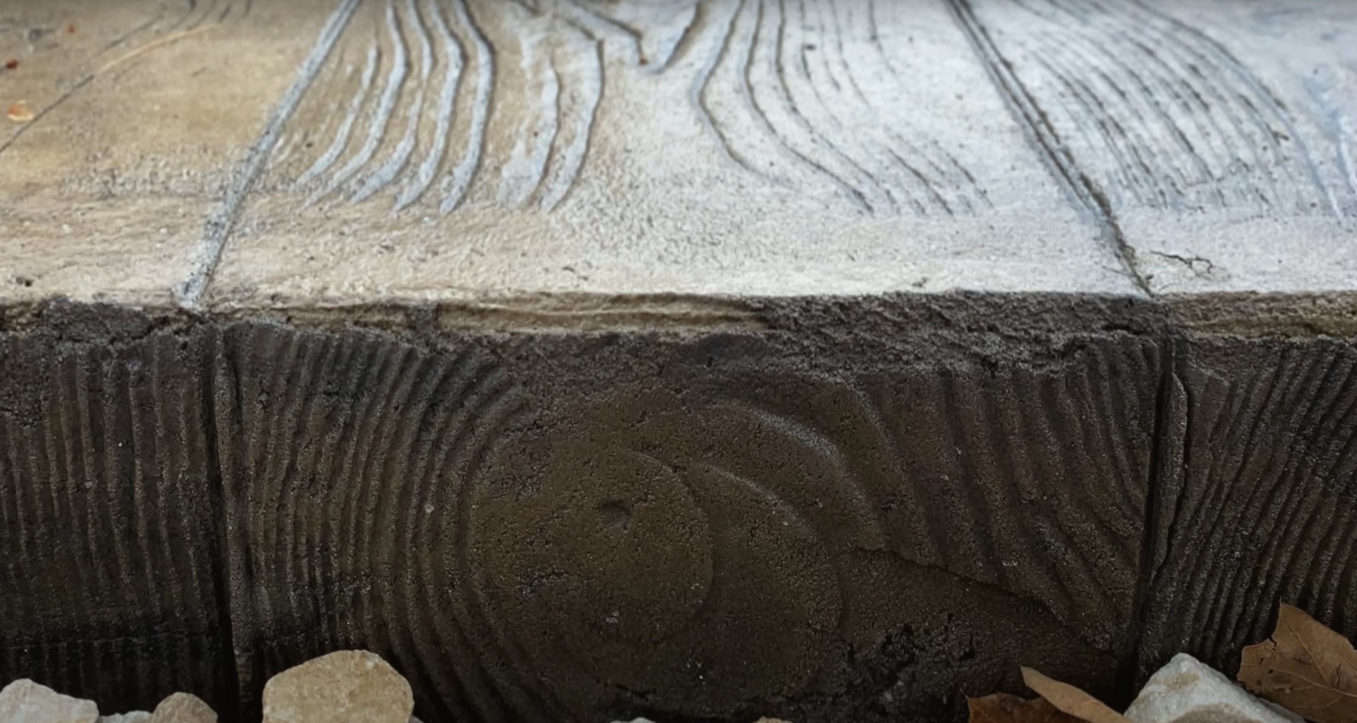 Professional concrete finishing work showing specialized brushed texture technique for enhanced traction and appearance
